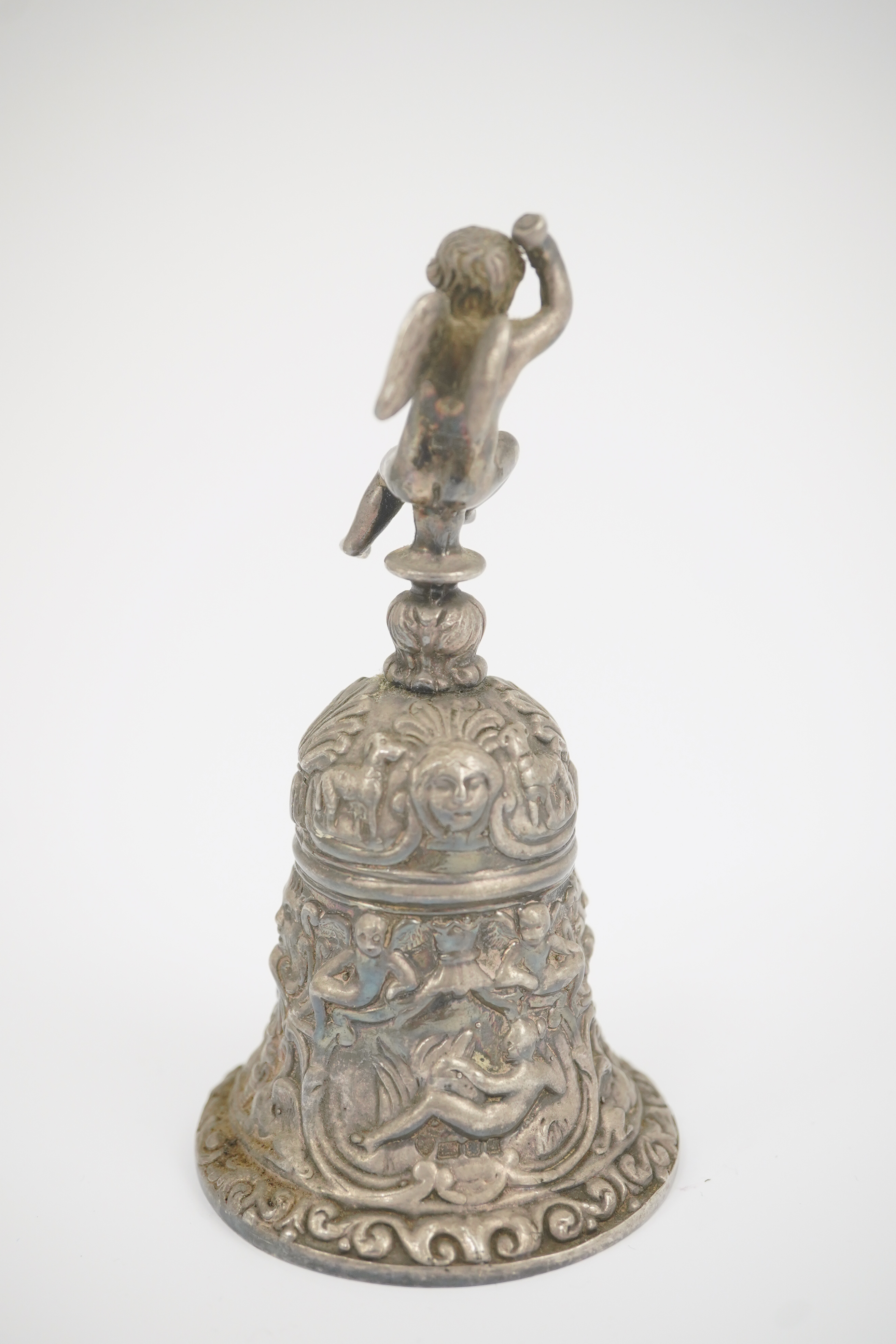 An Elizabeth II cast silver bell with Cupid handle, by D J Silver Repairs